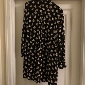 A black floral collared button up dress